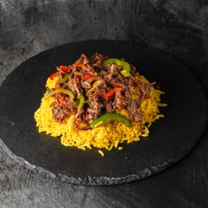 Pulled beef doner with peppers on saffron rice at Bross Slice and Grill