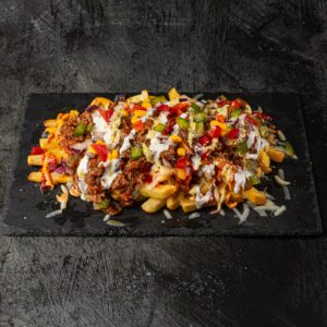 Crispy fries loaded with pulled beef, sweetcorn, peppers and cream sauce at Bross Slice and Grill