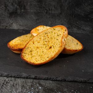Toasted herb garlic bread slices at Bross Slice and Grill