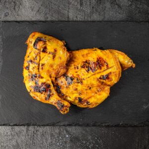 Half butterfly peri peri chicken grilled at Bross Slice and Grill