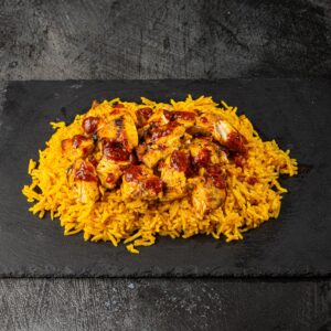 Grilled peri chicken strips on saffron rice at Bross Slice and Grill