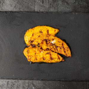 Three grilled peri peri chicken breast strips at Bross Slice and Grill