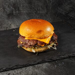 Double smash burger with melted cheddar and shredded lettuce in brioche bun at Bross Slice and Grill