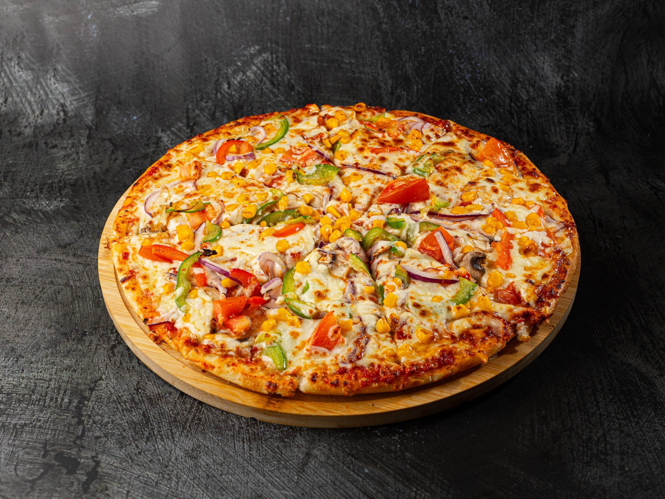 Vegetarian vege delight pizza with peppers, sweetcorn and mushrooms at Bross Slice and Grill